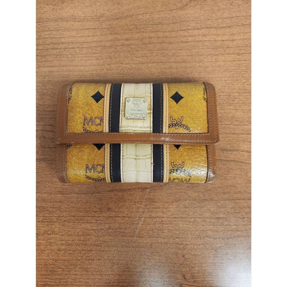 Mcm conganc leather compact wallet  Eight card slots and lots of compartments  E